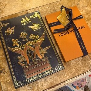 Louis Vuitton limited-edition gift bag, box with gift tag, and ribbon.
